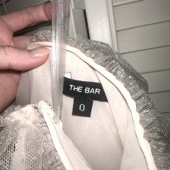 Super fun and cute dress from The Bar! Love the neckline, sparkles, and ruffles! - Picture 2 of 4